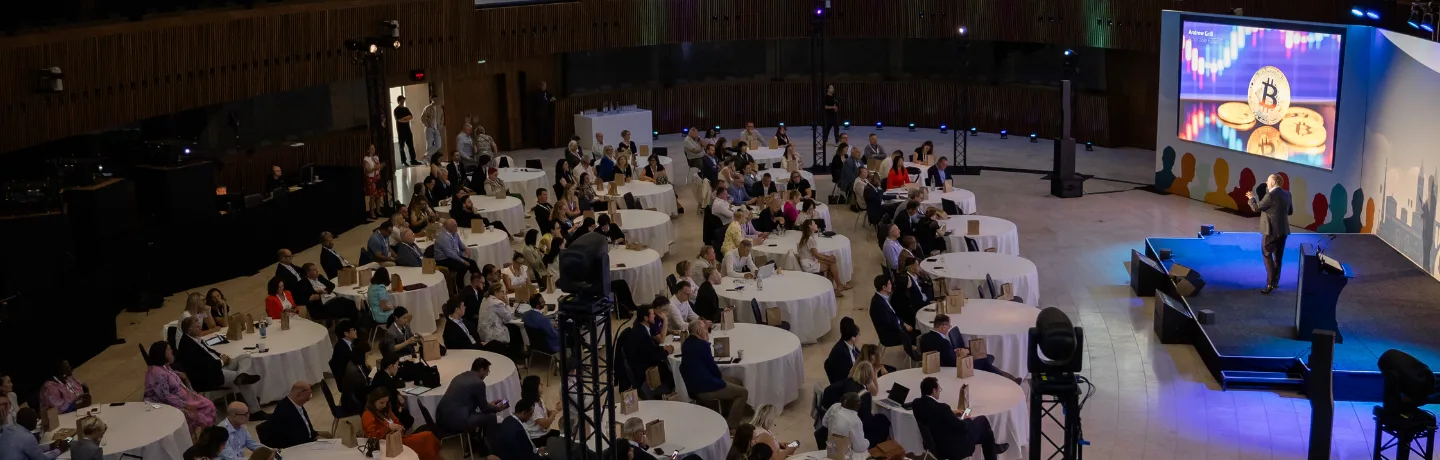 AI Expert Andrew Grill on stage in Luxembourg speaking on how event organisers can harness the power of AI